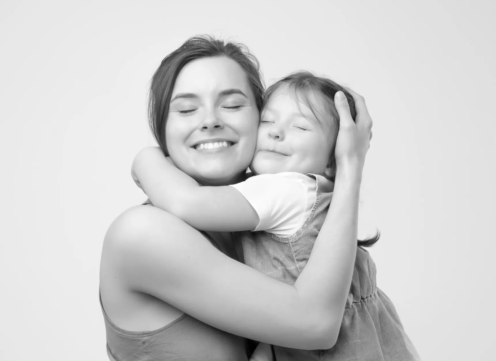 a woman holding a child in her arms